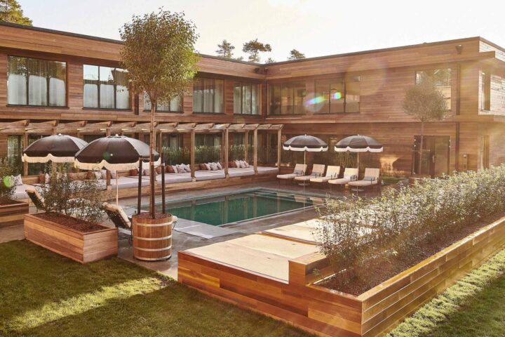 Outdoor pool in a timber-clad courtyard at Ellery Beach House.