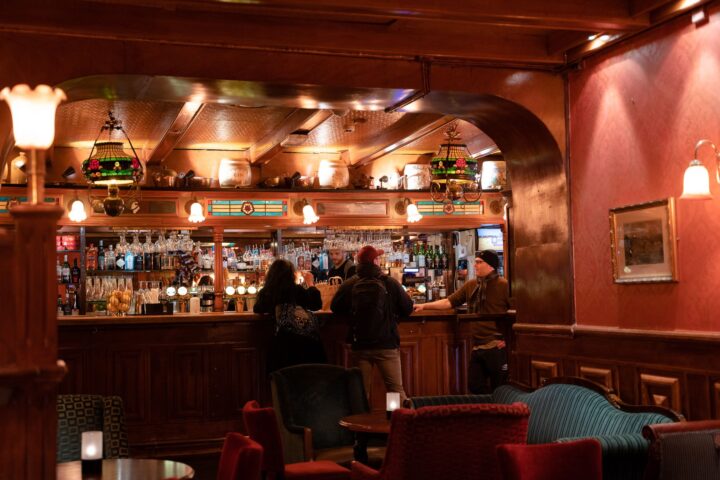 Bar and seating area inside The Scotsman in Oslo.